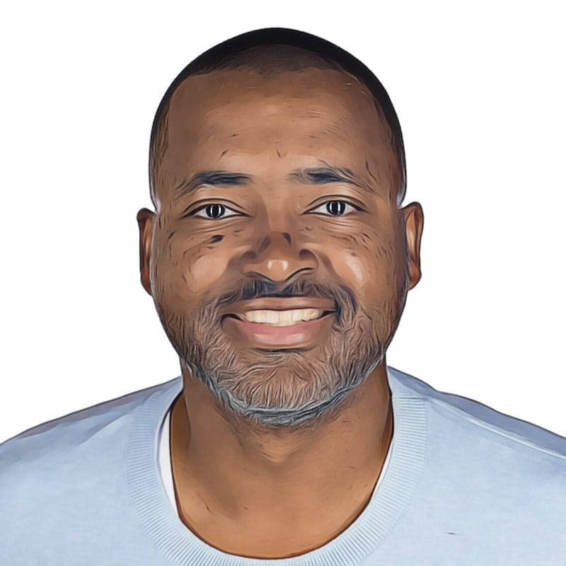 Kilimanjaro Robbs, smiling, in a light blue sweater